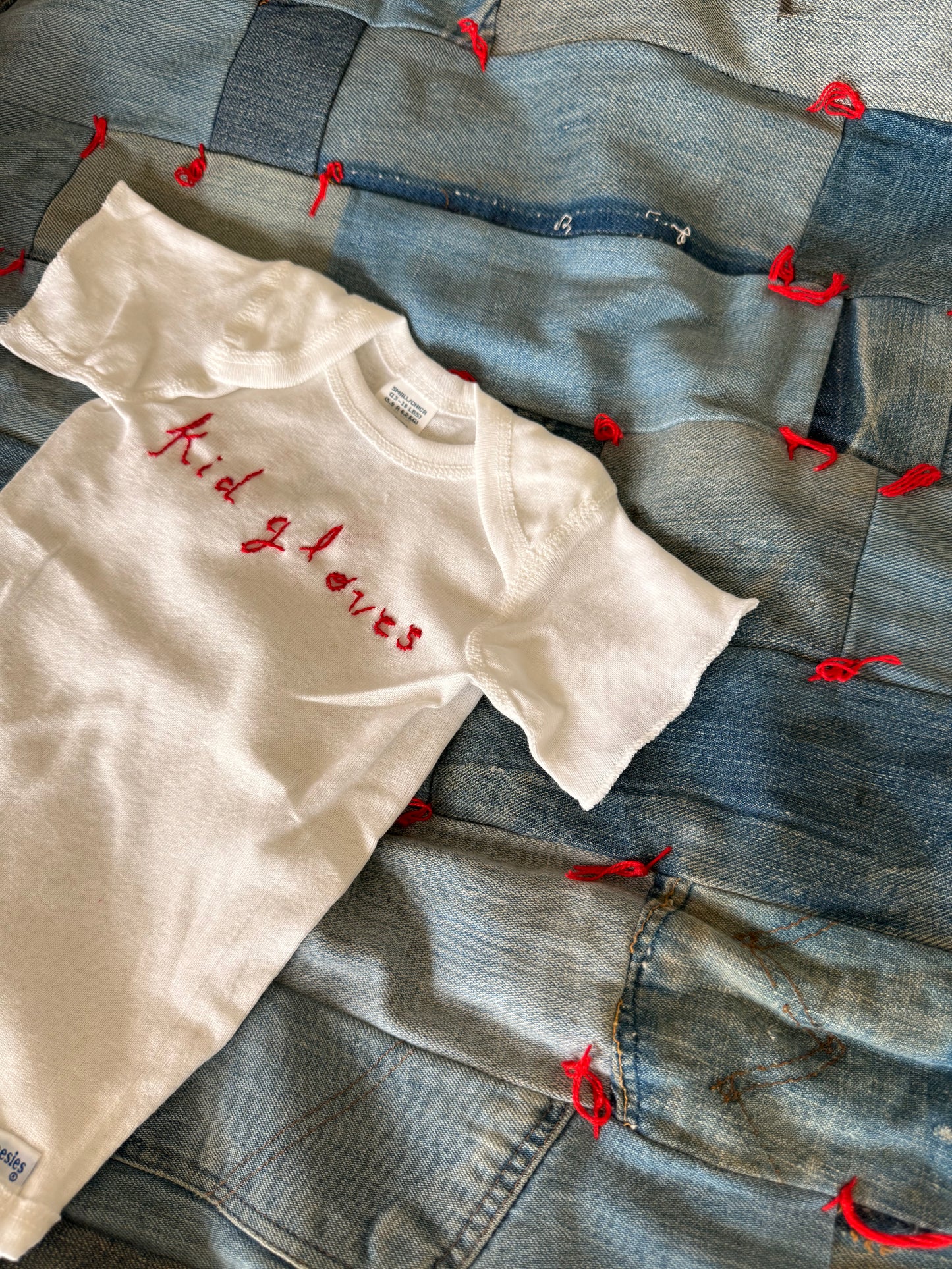 MADE BY KID GLOVES : hand embroidered logo onesie
