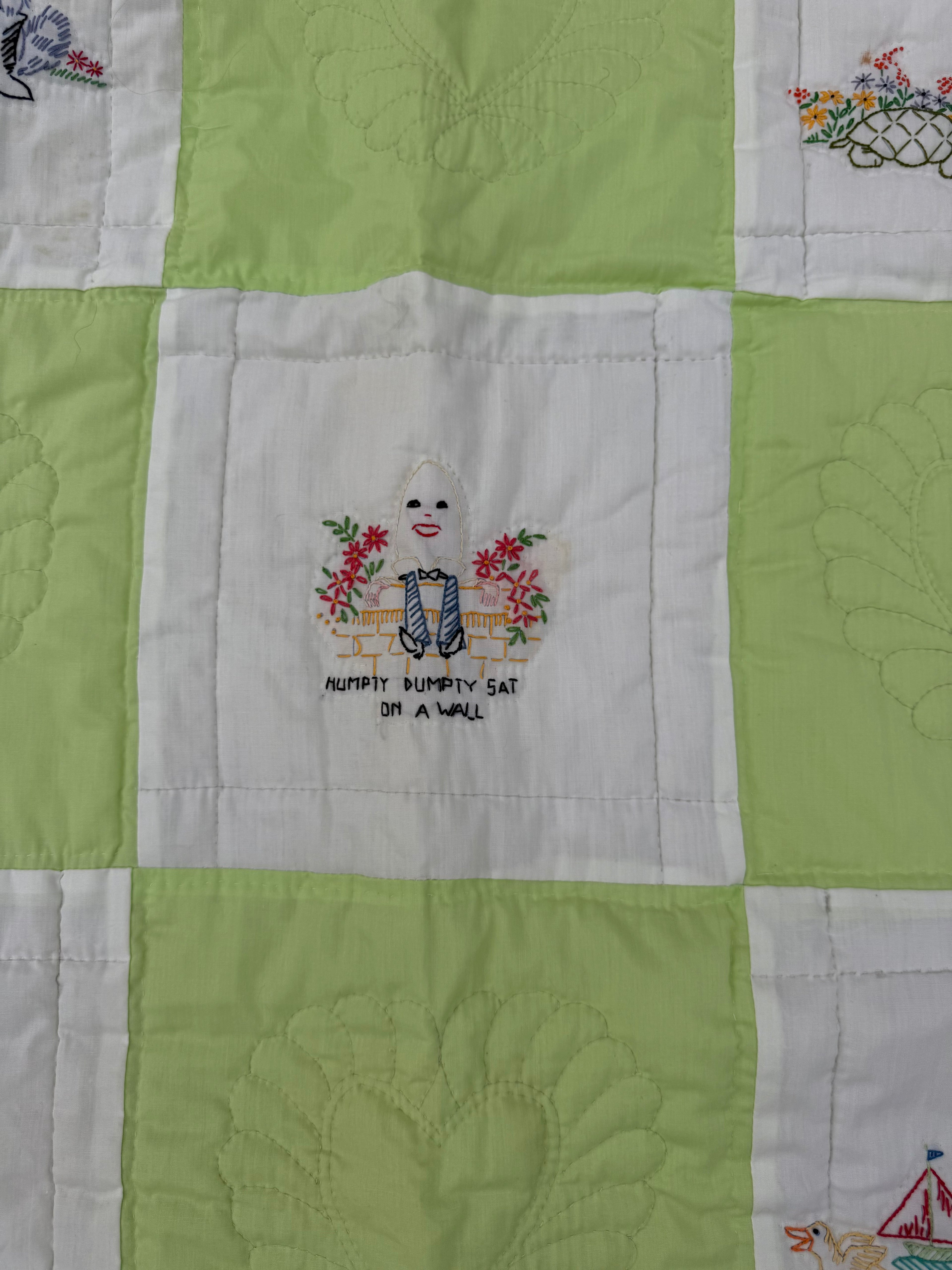 1970s embroidered nursery rhyme crib quilt
