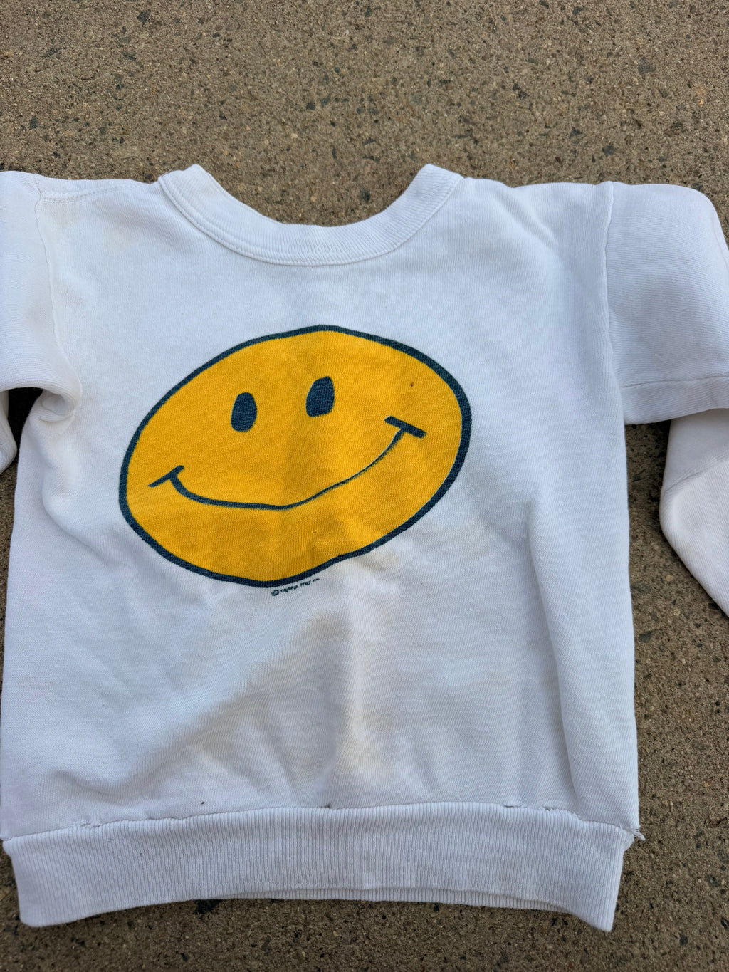 1970s smiley face sweatshirt