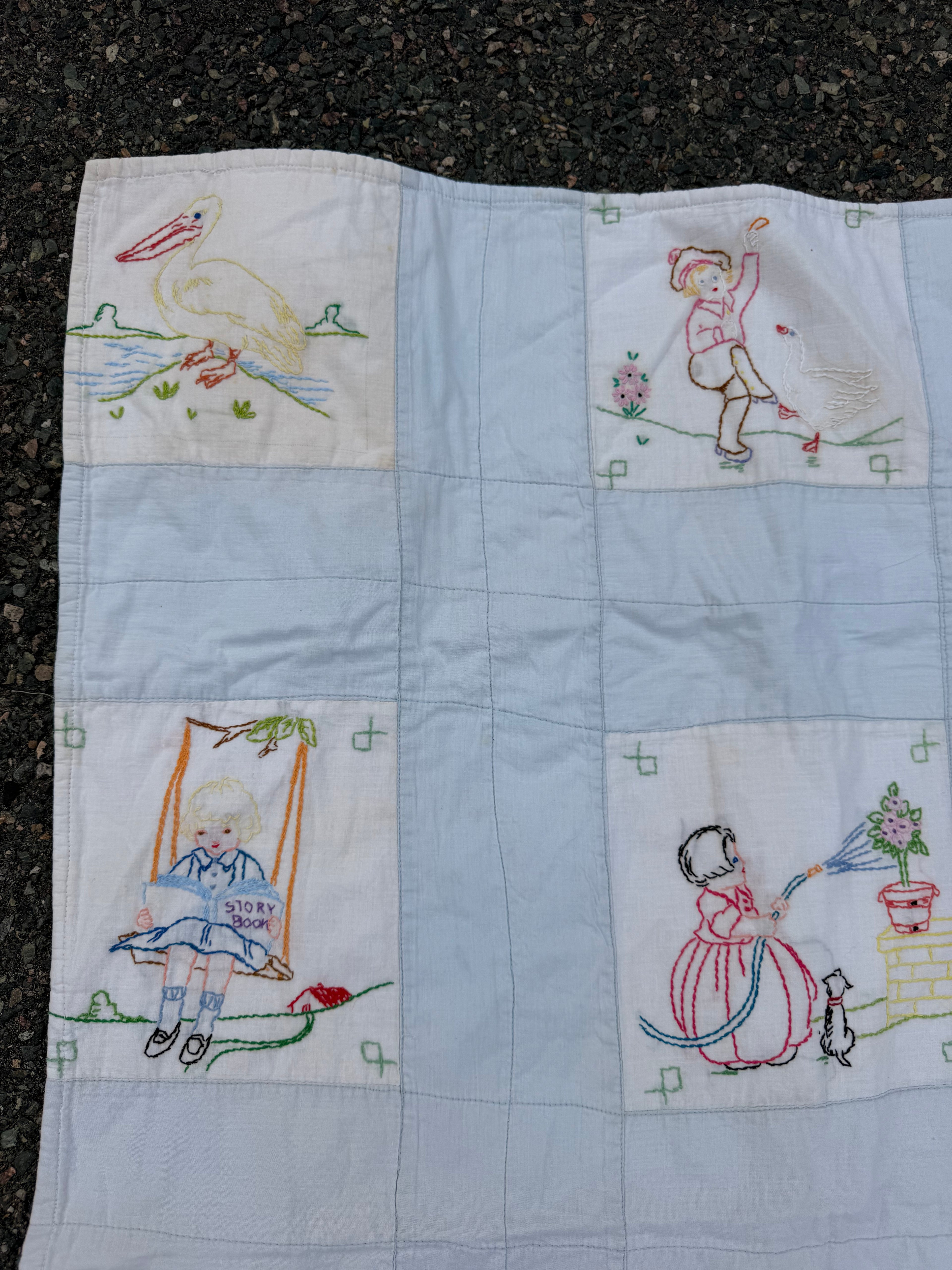 1940s embroidered story book crib quilt