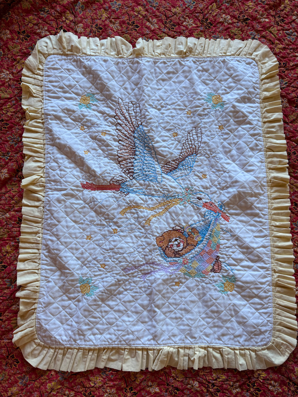 1980s stork cross stitch crib quilt