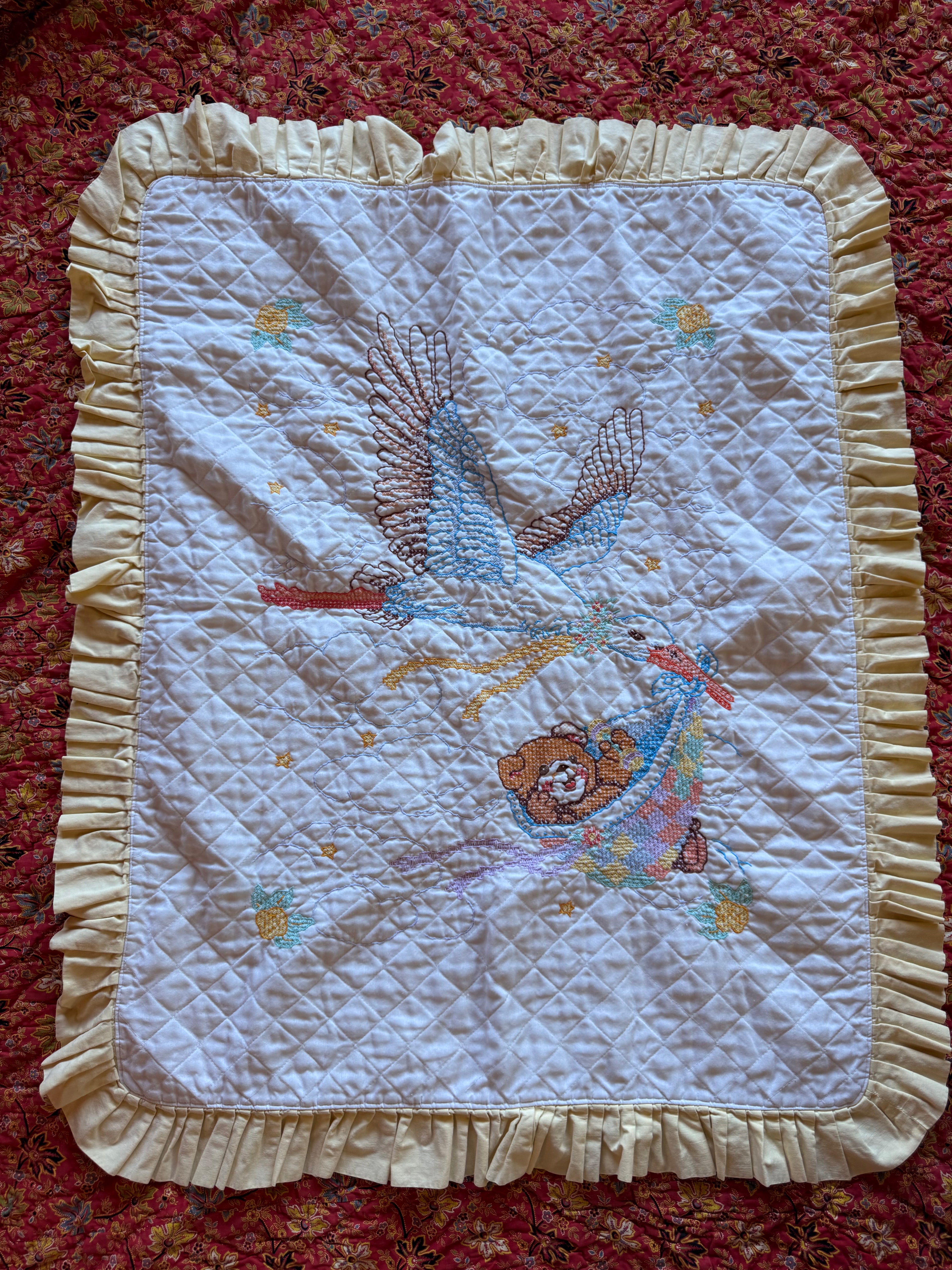 1980s stork cross stitch crib quilt
