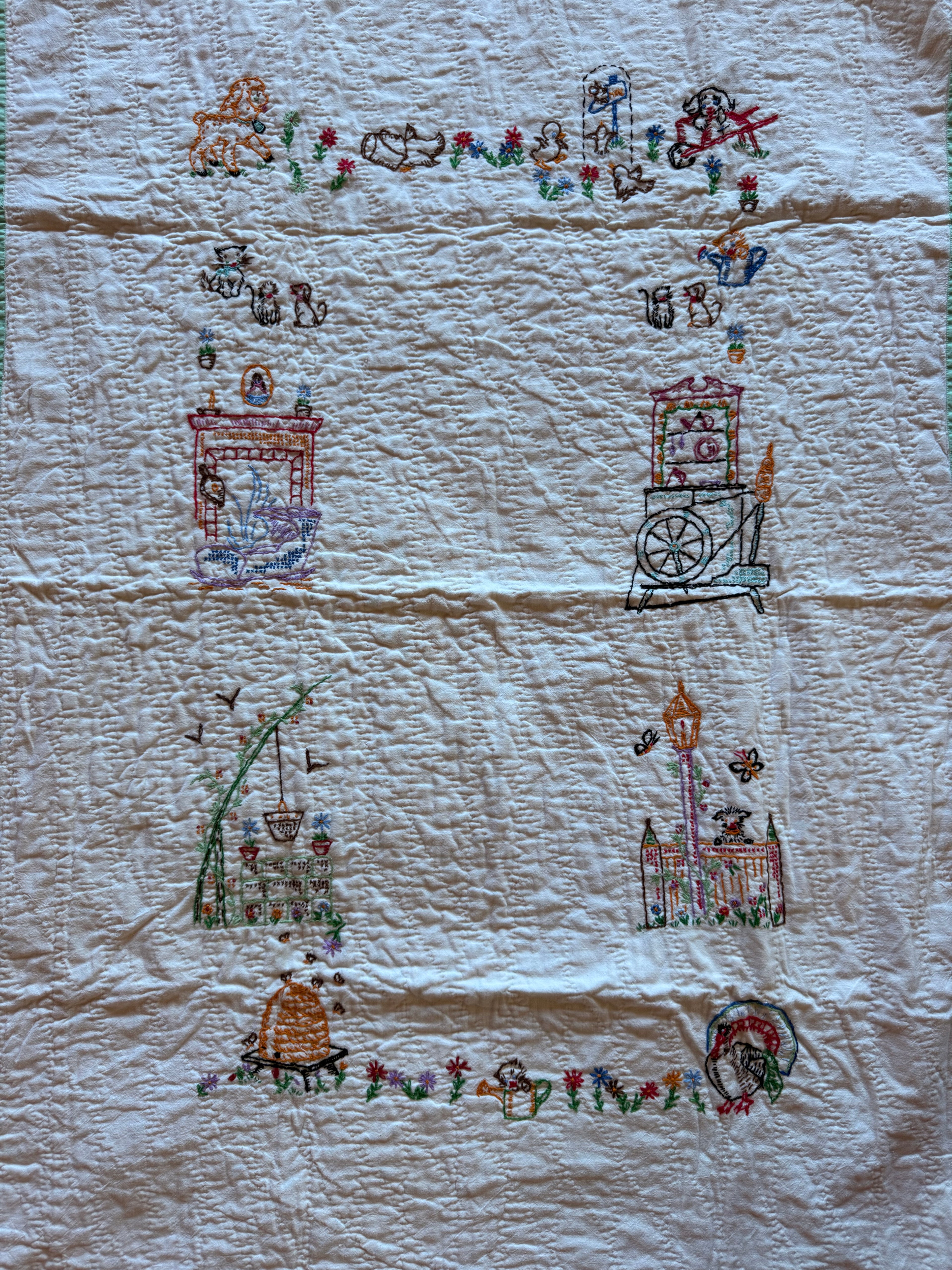 1950s embroidered garden crib quilt