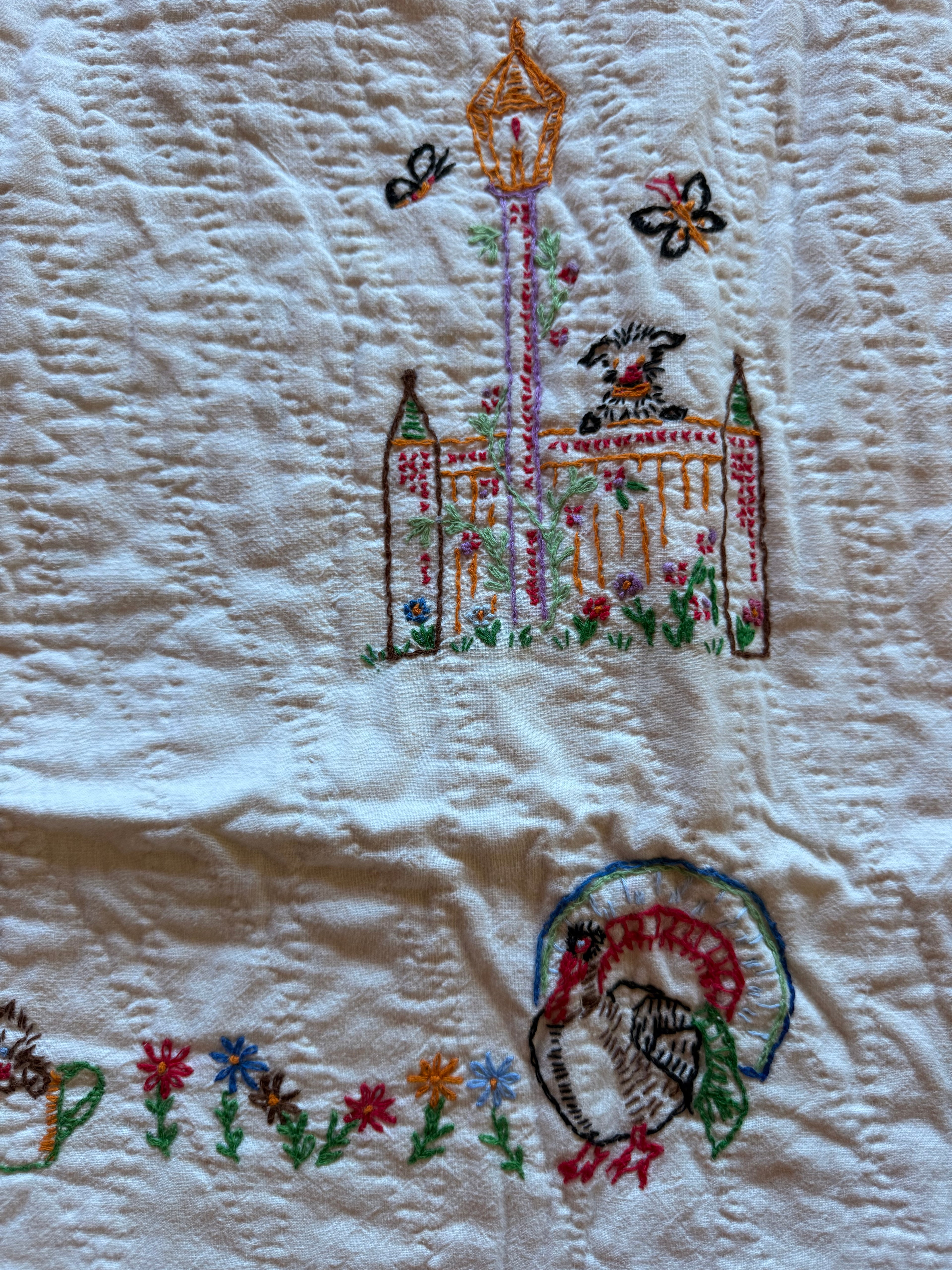 1950s embroidered garden crib quilt