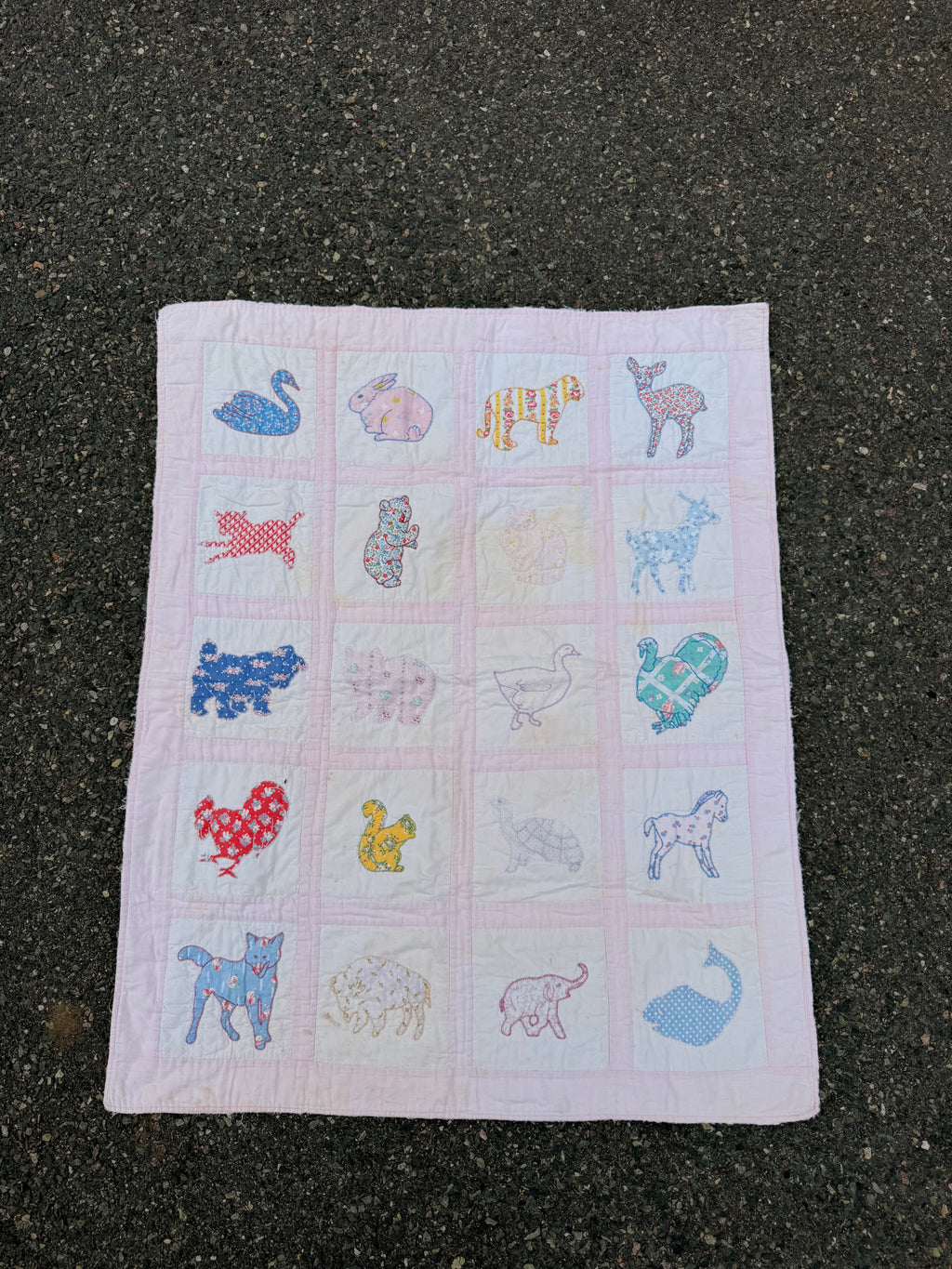 1940s appliqué animals of many fabrics crib quilt