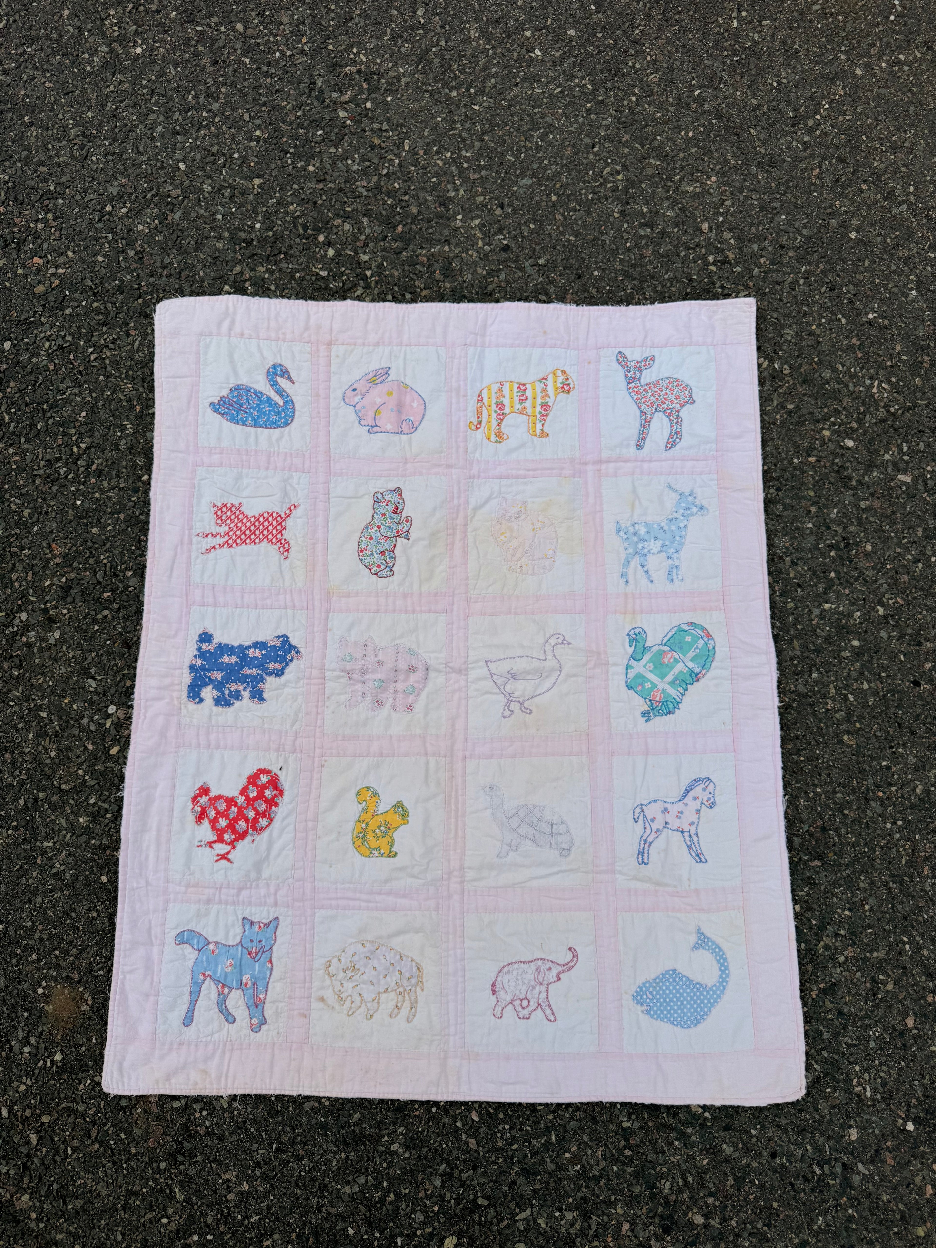 1940s appliqué animals of many fabrics crib quilt