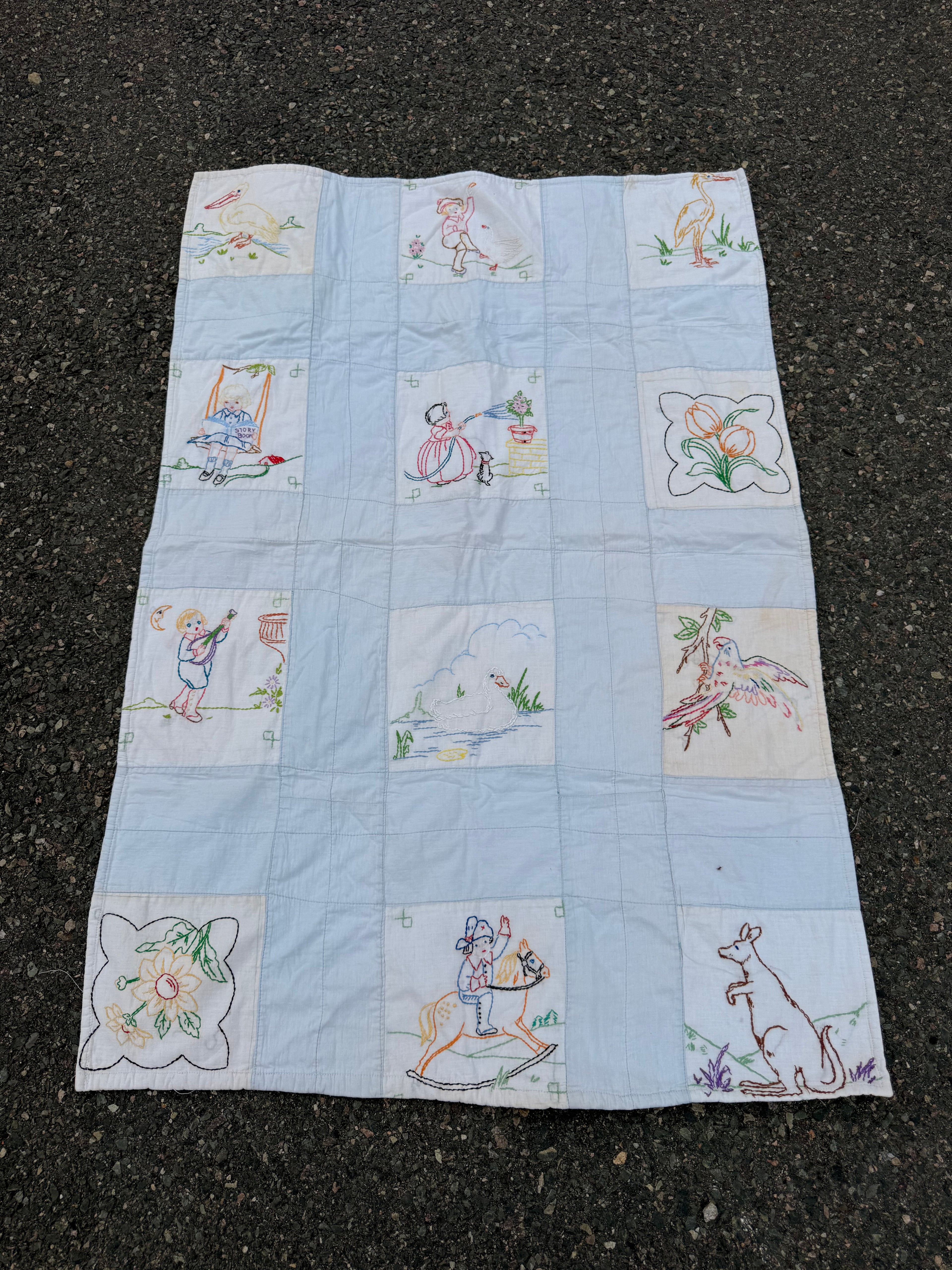 1940s embroidered story book crib quilt