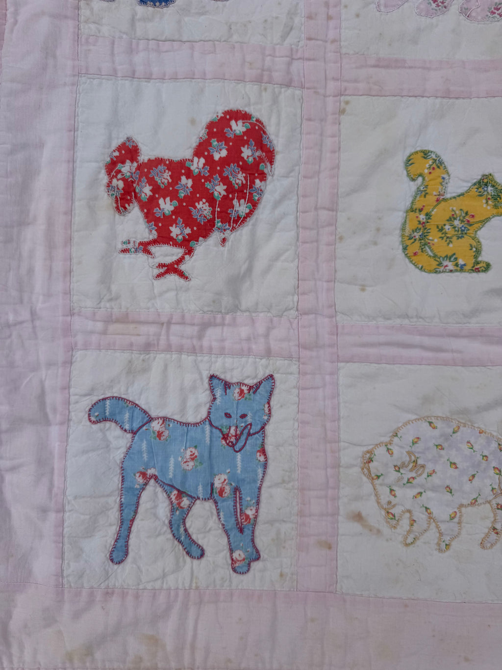 1940s appliqué animals of many fabrics crib quilt