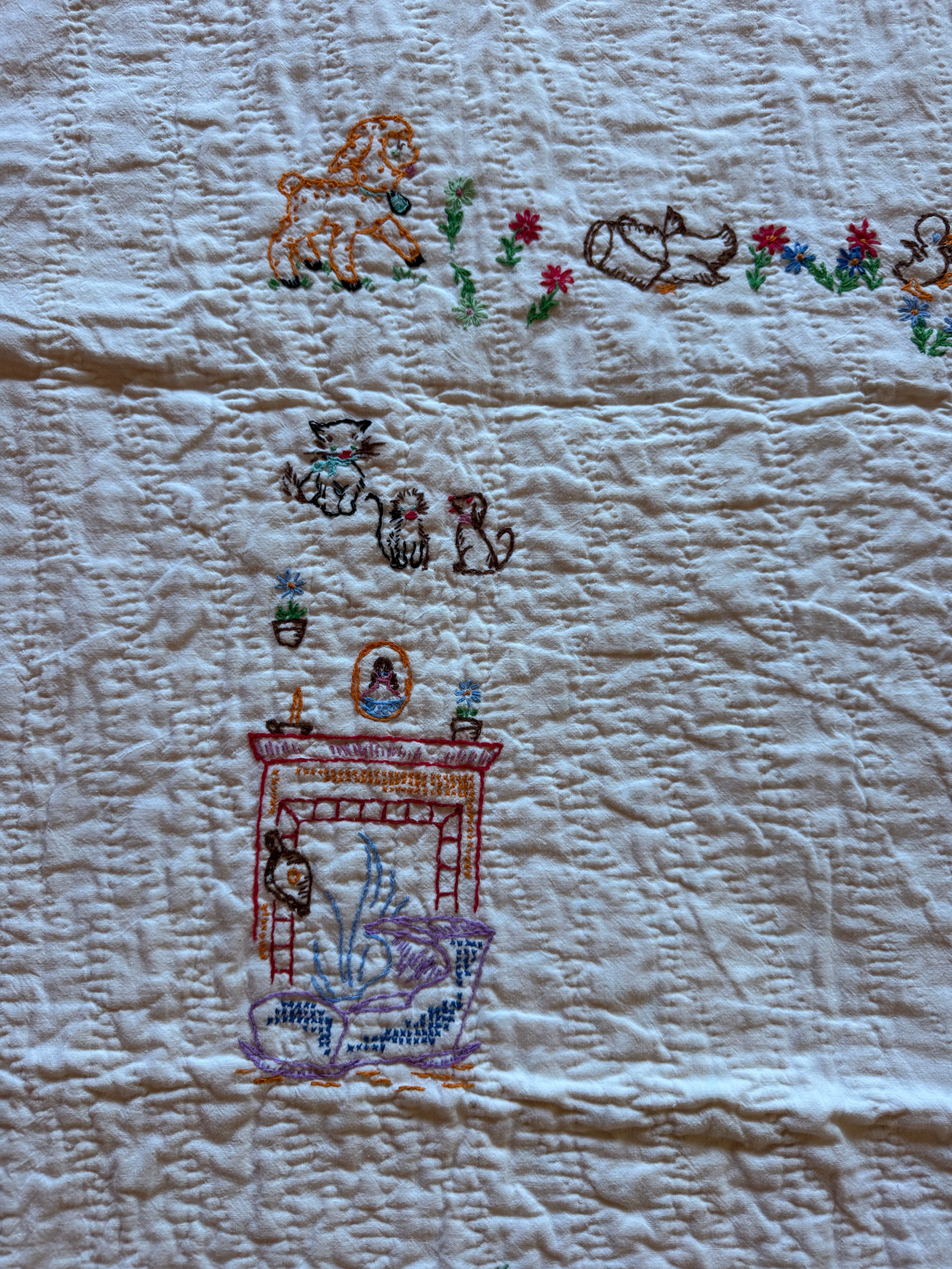1950s embroidered garden crib quilt