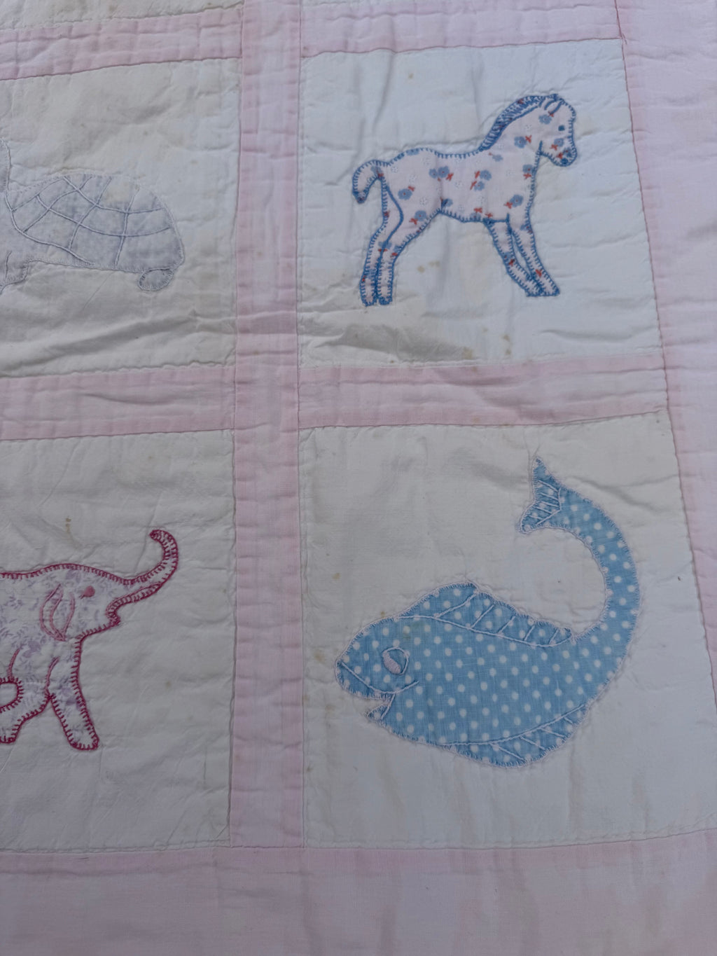 1940s appliqué animals of many fabrics crib quilt