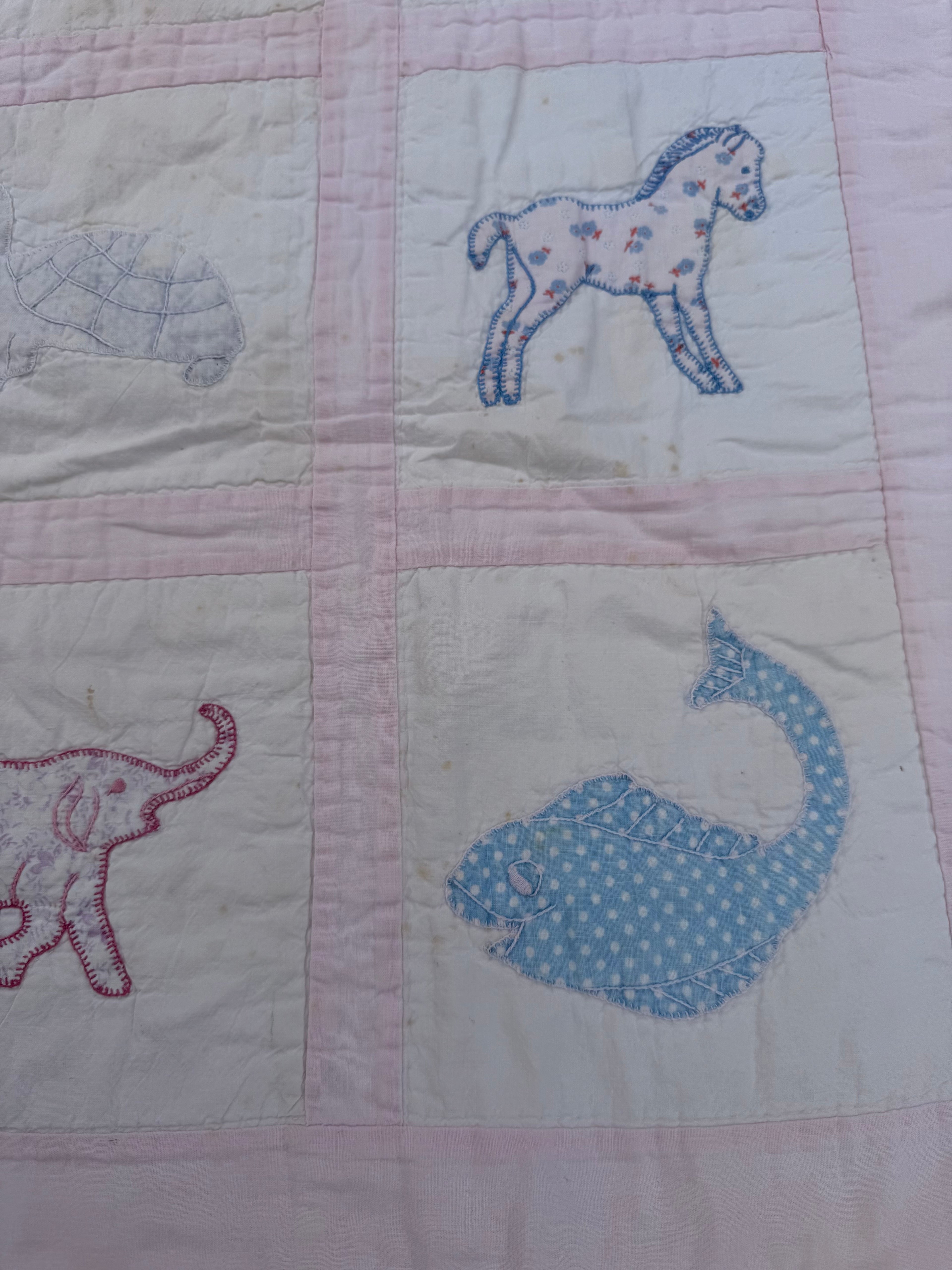 1940s appliqué animals of many fabrics crib quilt