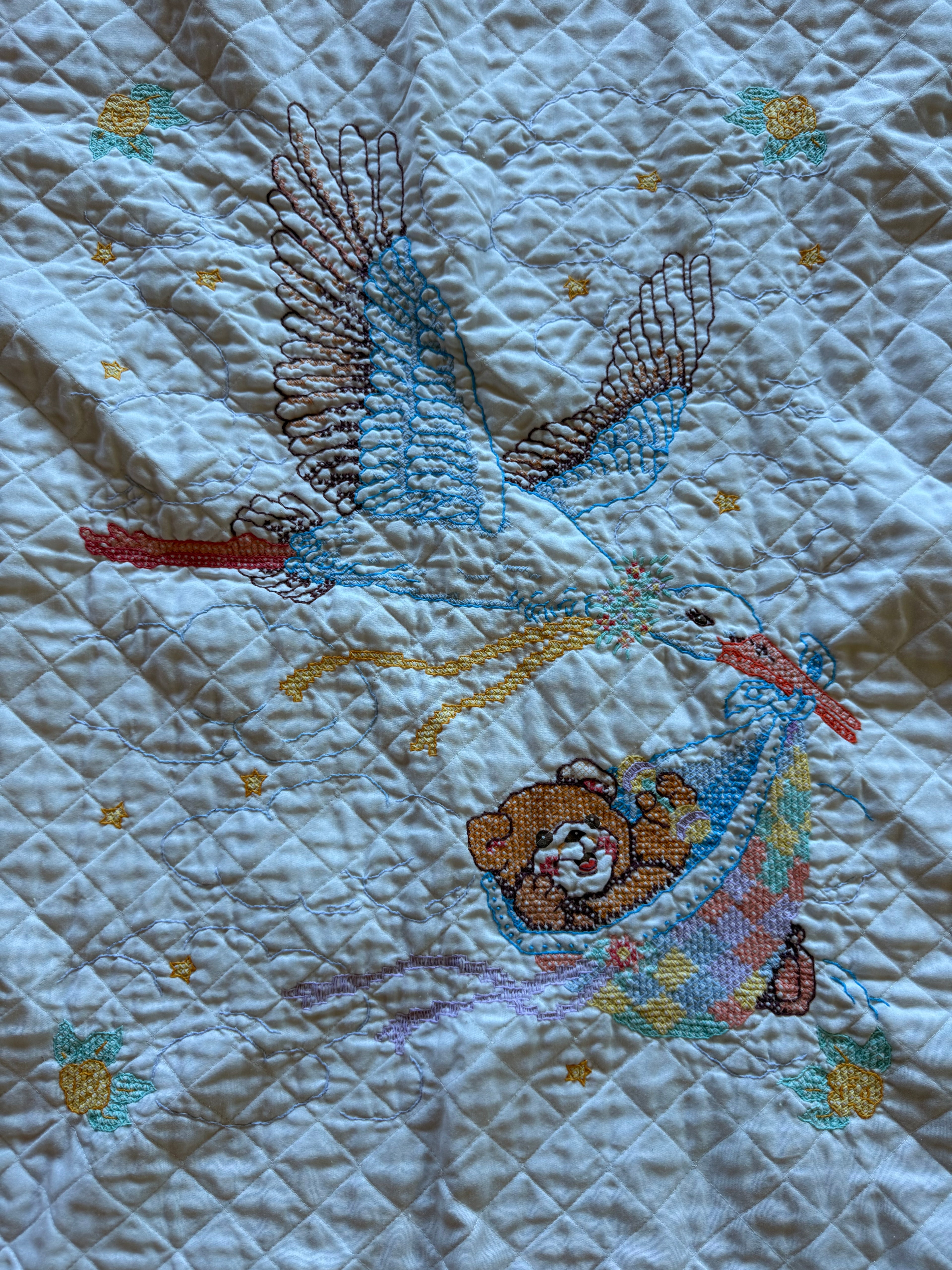 1980s stork cross stitch crib quilt